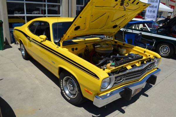 Yellow and black plymouth duster muscle car