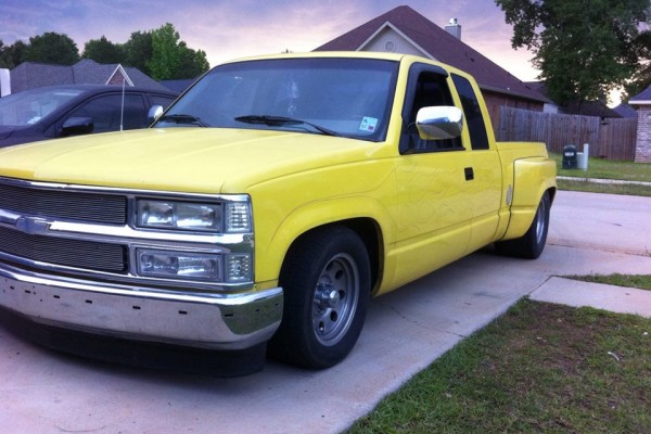 a custom dually yellow chevy silverado squarebody truck