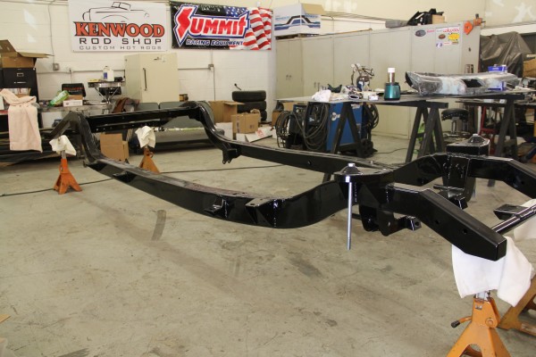the bare frame of a 1953 Plymouth suburban hot rod build