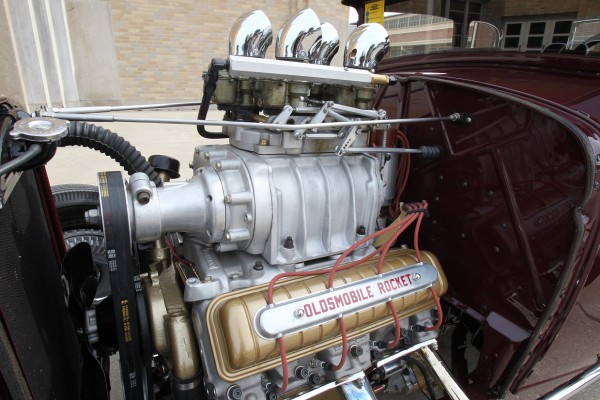 supercharged Oldsmobile rocket v8 engine in a hot rod