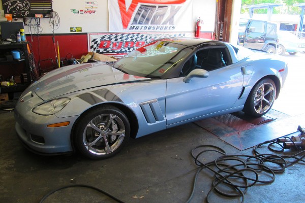 c6 corvette in a tuning shop on dyno drums