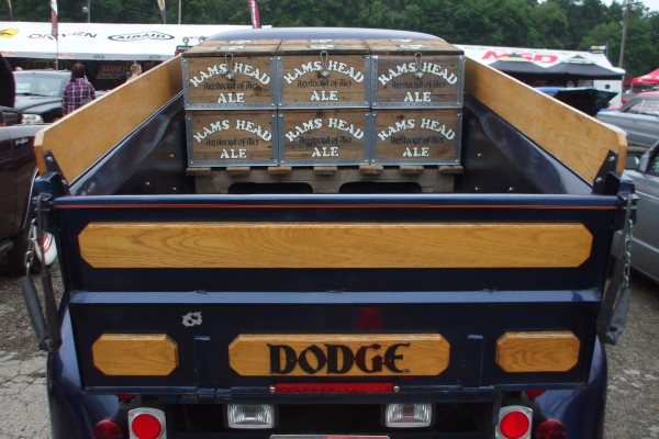 classic dodge pickup truck with bed full of vintage beer crates