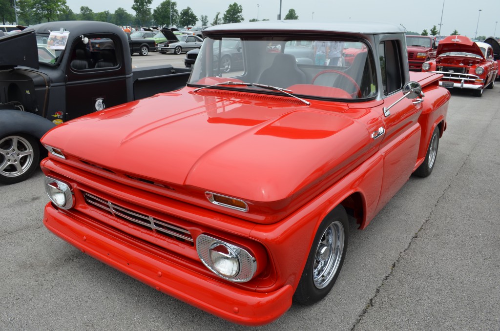vintage red chevy pickup truck with custom paint and wheels