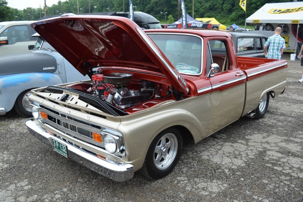 customized 1964 ford f-100 pickup truck with aftermarket weld wheels