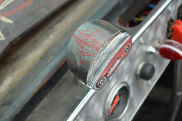 pinstriped gauge cup on a vintage hot rod