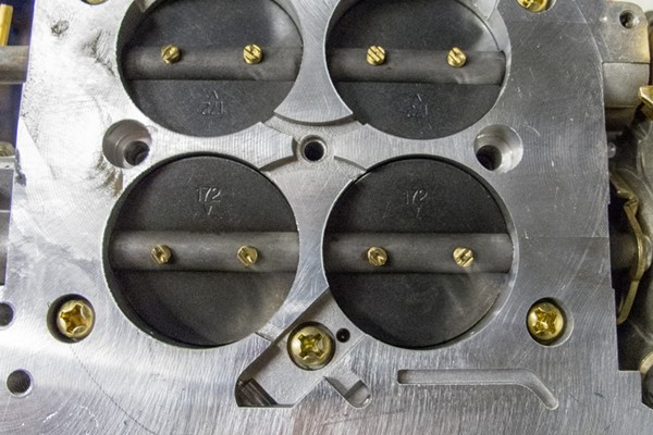 underside view of barrels on a four barrel carburetor