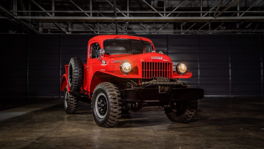 red dodge power wagon front in an empty warehouse, press photo