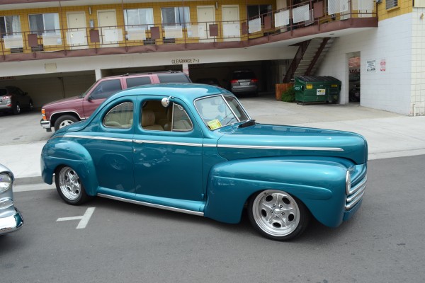 vintage blue custom prewar hot rod coupe on street