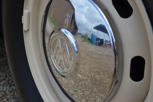 close up of a chrome VW beetle hubcap