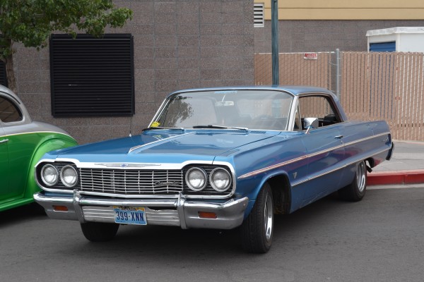blue 1964 chevy impala coupe parked on street during 2014 Hot August Nights in Reno, NV