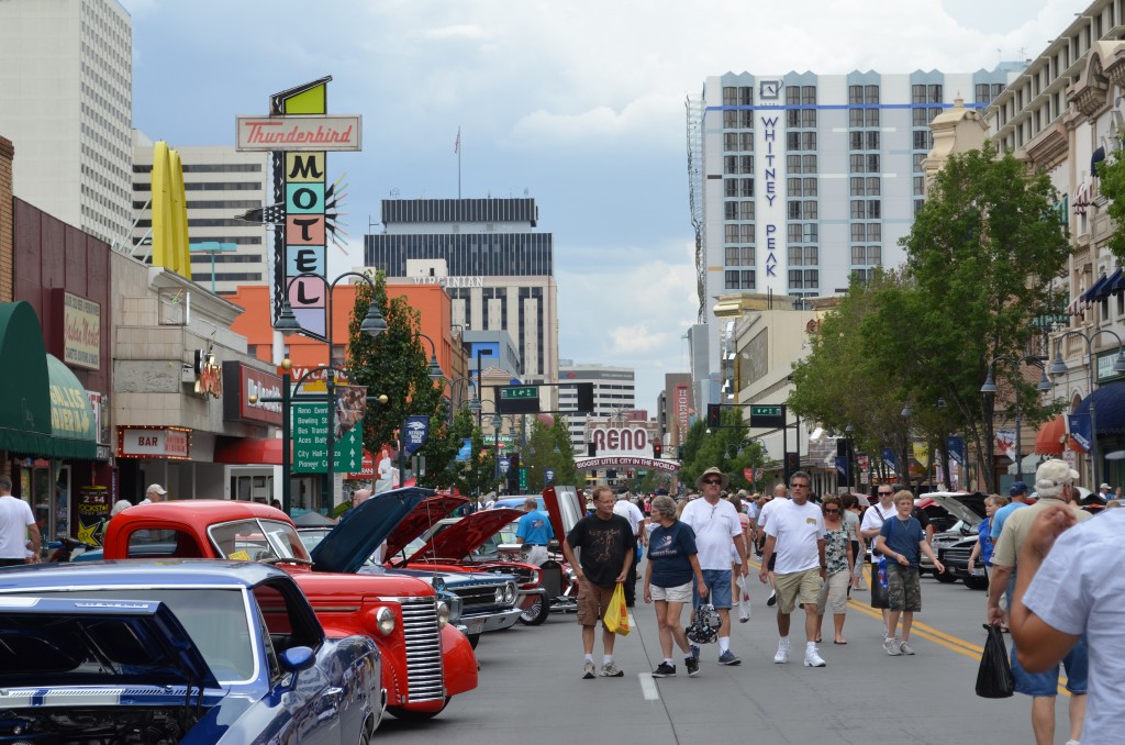 crowds walking along street with classic cars at 2014 Hot August Nights in Reno, NV