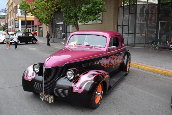 vintage flamed hot rod coupe parked on street at hot august nights 2014