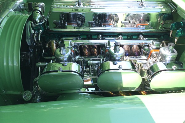 customized inline engine under the hood of a hot rod