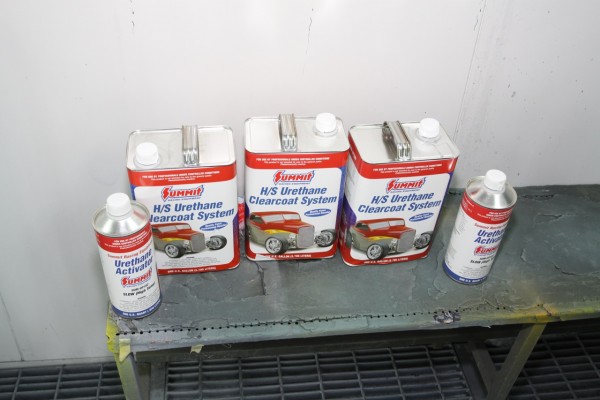 summit racing paint cans sitting on a shelf