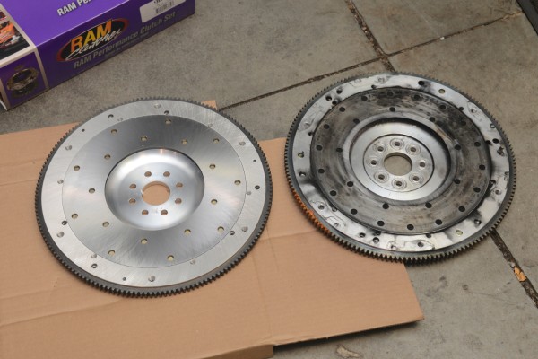 a new billet aluminum flywheel compared to a old worn flywheel