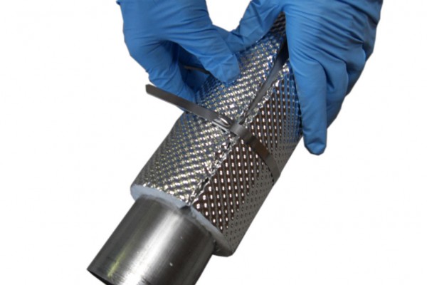 man wrapping Heatshield Armor exhaust heat shield around tube