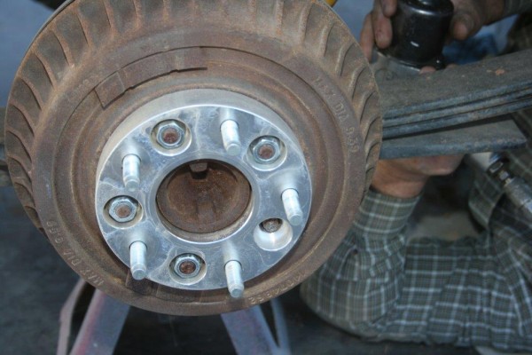 an old jeep drum brake hu with a wheel adapter spacer installed