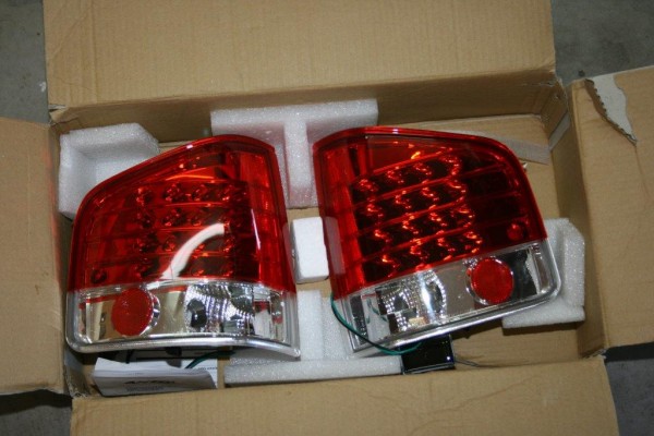 a pair of aftermarket truck taillights in box