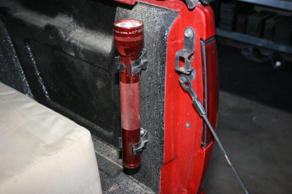 flashlight mount installed in a truck bed