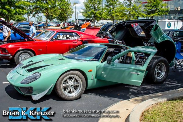 green ford gt supercar with rear engine hatch open