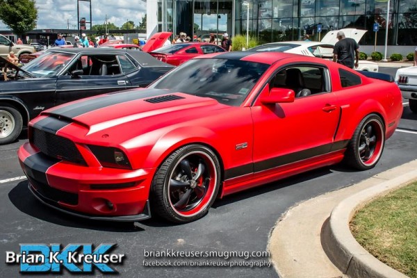 lowered ford s197 mustang with red and black vinyl wrap