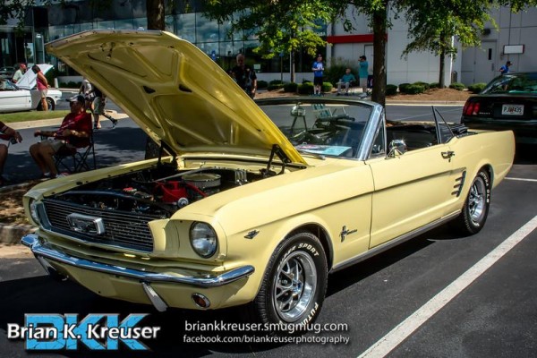yellow ford mustang first gen convertible