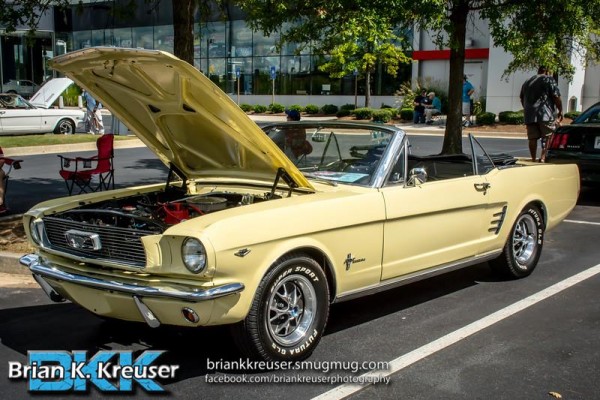 early first gen yellow ford mustang convertible