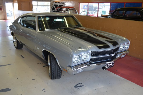 silver Chevy Chevelle ss 396 parked inside at atlanta motorama