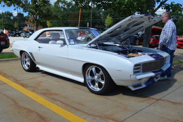 white restomod chevy 1969 camaro rs with side pipes pro touring style