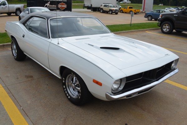 white 1973 plymouth cuda 340 in parking lot