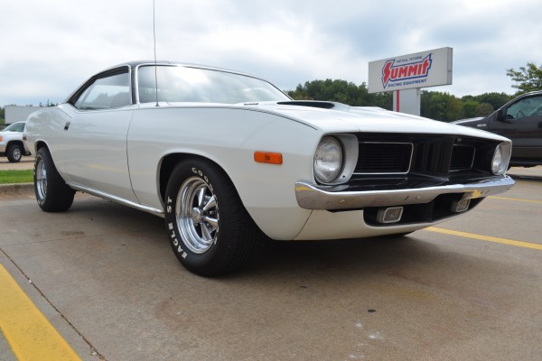 white 1973 plymouth cuda at summit racing in akron ohio