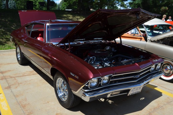 maroon Chevy Chevelle at a car show