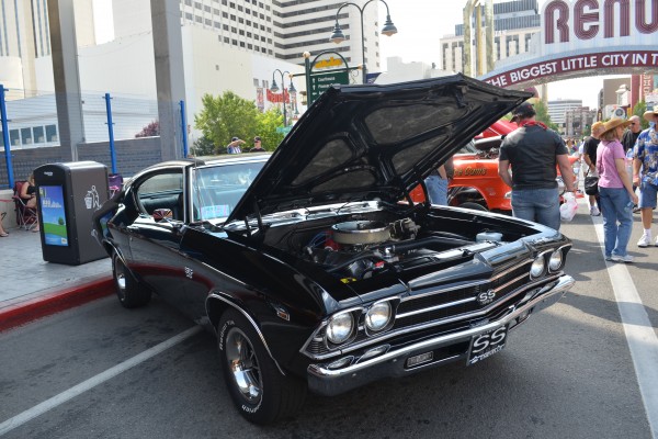black chevy chevelle ss parked near Reno sign during hot august nights