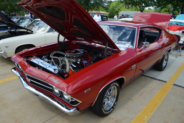 red second gen Chevy Chevelle parked at summit racing car show
