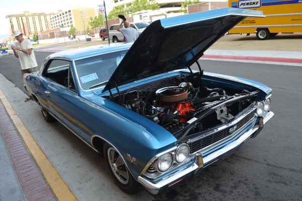 Chevy Chevelle ss parked on street with hood up