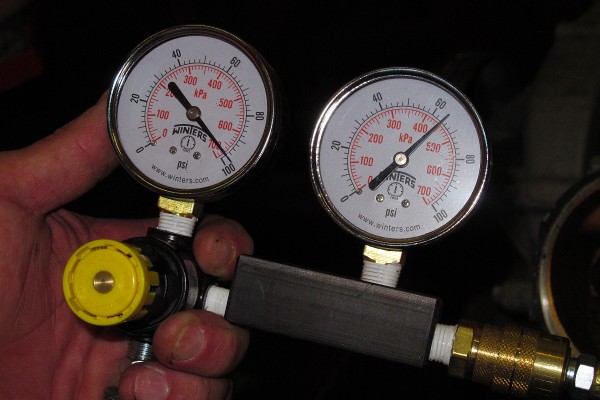 close up of a leakdown test gauge comparison