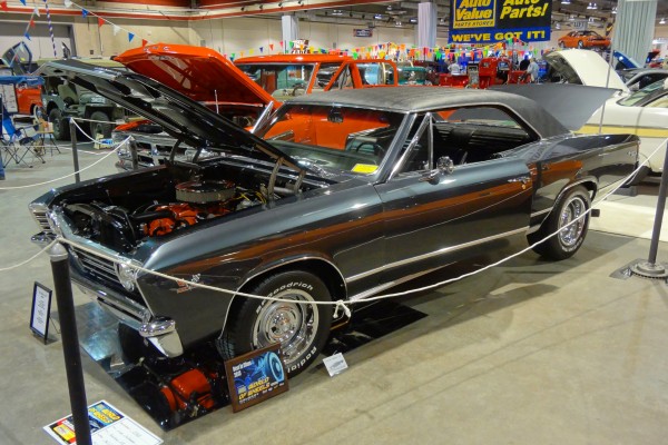 grey Chevy Chevelle at indoor car show, first gen