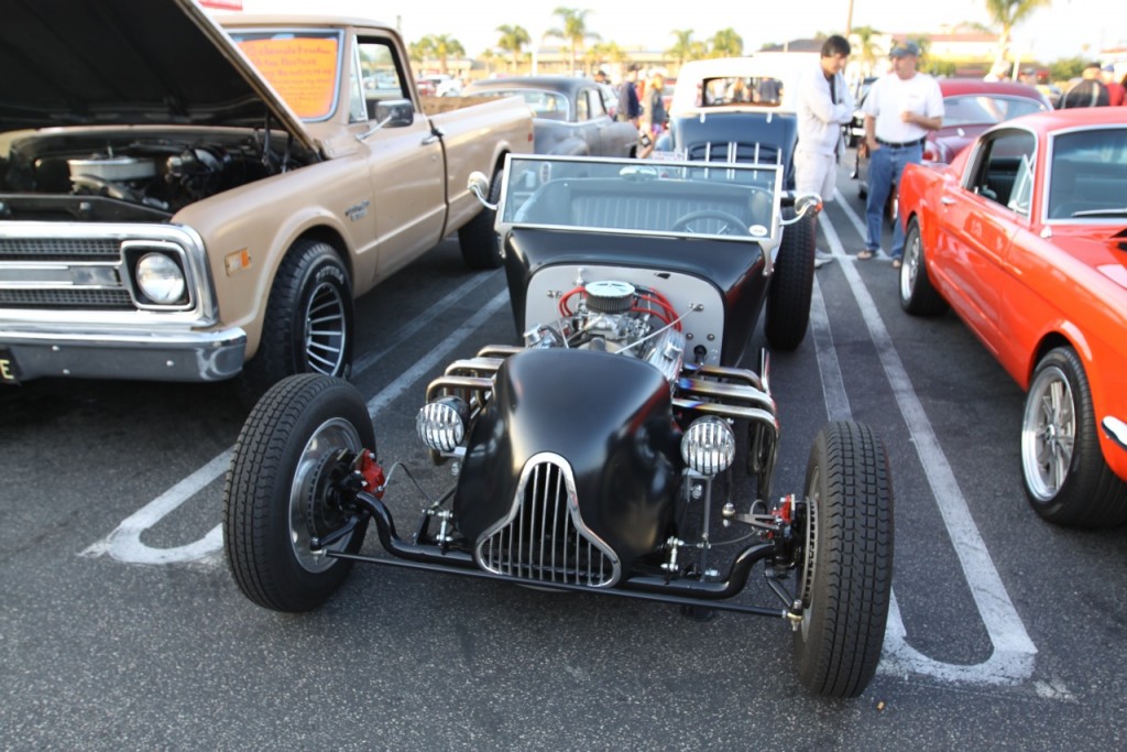 vintage model t bucket ford hot rod at a car show