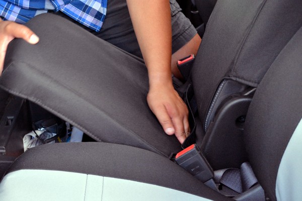slipping a seat cover onto a vehicle seat