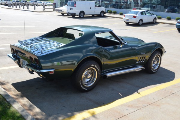 side shot of a green 1969 chevy corvette stingray 427 coupe
