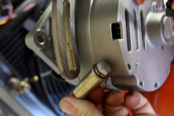 installing an adjustable engine alternator bracket bolt
