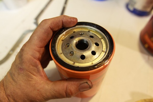 putting an oil film on the gasket of an oil filter prior to install