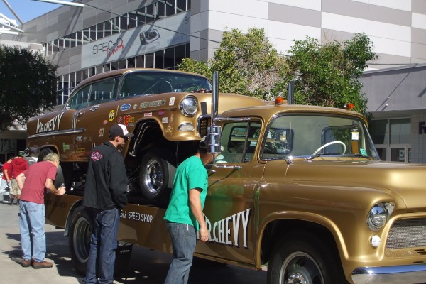 vintage chevy flatbed truck hauling a 1955 chevy gasser hot rod