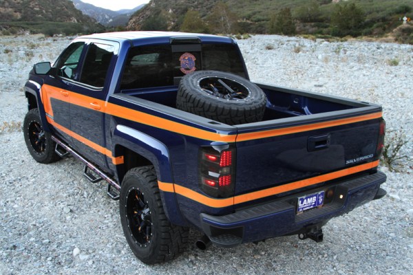 rear quarter view of a customized chevy silverado off road truck