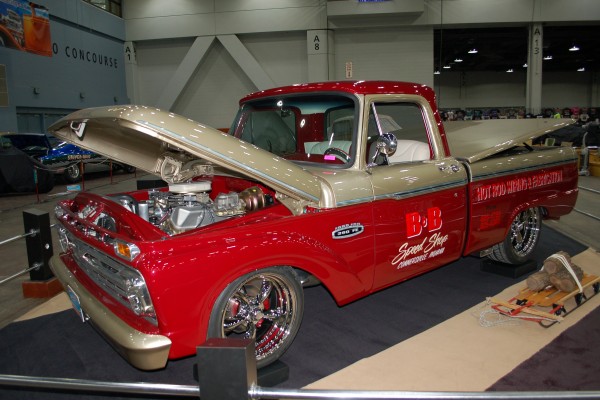 custom ford pickup truck on display in indoor car show