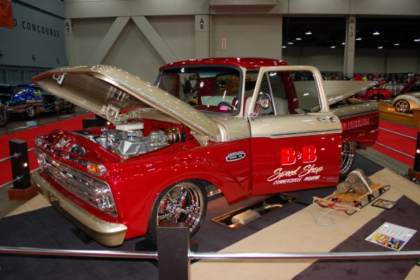 vintage ford restomod truck on display in indoor car show
