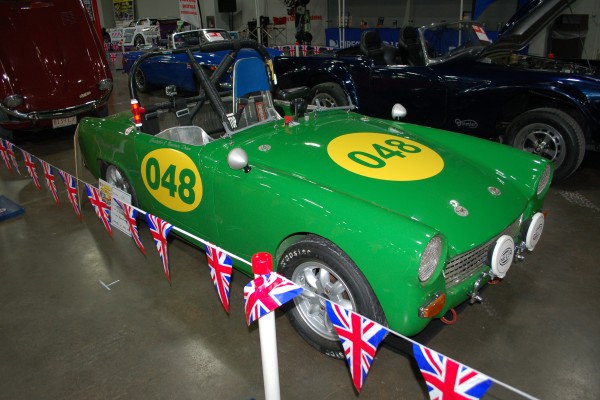 green MG british race car on display in indoor car show
