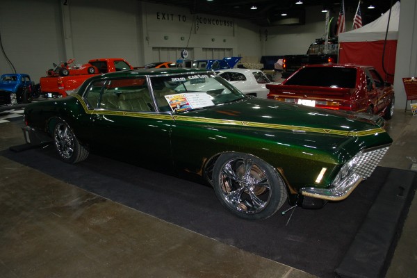 green customized Buick boat tail Riviera lowrider