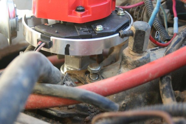 installing a distributor and clamp on an engine