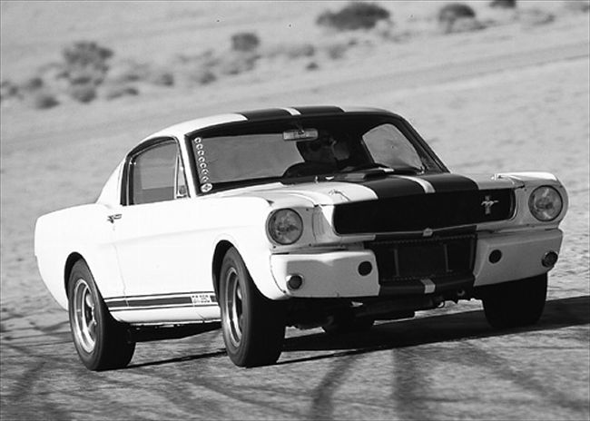 vintage photo of a shelby gt350 mustang on race track